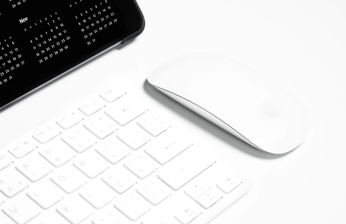 A minimal computer workspace with a keyboard and mouse